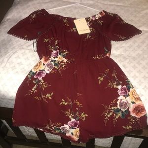 Floral off the shoulder romper.